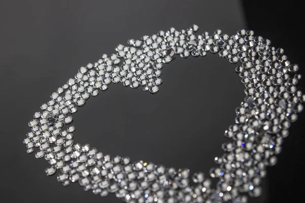 Heart made of rhinestones on black background — Stockfoto