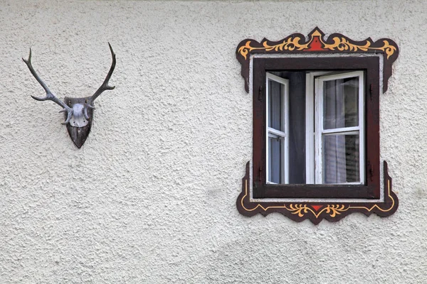 Bavarian rural window with typical painted frame decorations — Stock Photo, Image