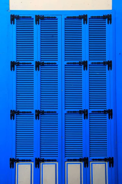 vintage bright blue window shutters