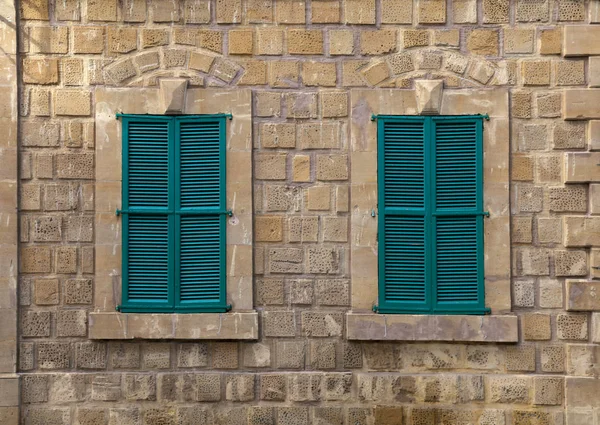 Windows with green shutters on an old house — Stock Photo, Image