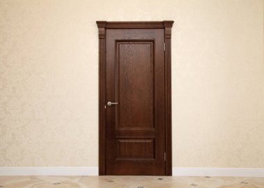 beige room interior with brown wooden door clipart