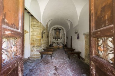 Interior view of a small and ancient church in Tuscany in Italy