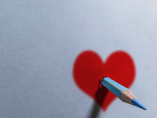 Pencil Holing Sheet Paper Heart Drawn — Stock Photo, Image