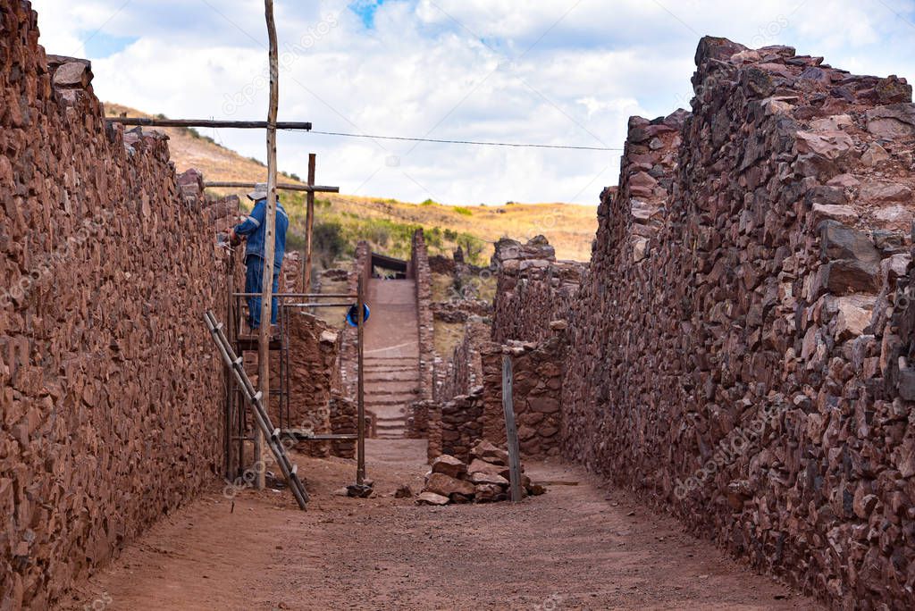Ancient walls and buildings at the Pikillacta archaeological site. Cusco, Peru 