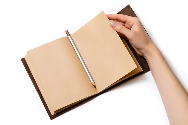 Female Hand Turns Page Open Craft Notepad Which Lies Gray — Stock Photo, Image