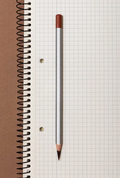 White Checked Notebook Gray Pencil Brown Background — Stock Photo, Image