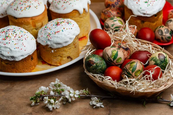 Easter Cakes Easter Eggs Wicker Basket Blooming Twig Wooden Background — Stock Photo, Image