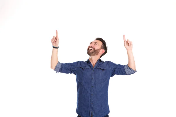 Happy mature man pointing at copy space — Stock Photo, Image