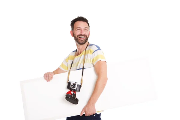 Laughing mature photographer with blank poster — Stock Photo, Image