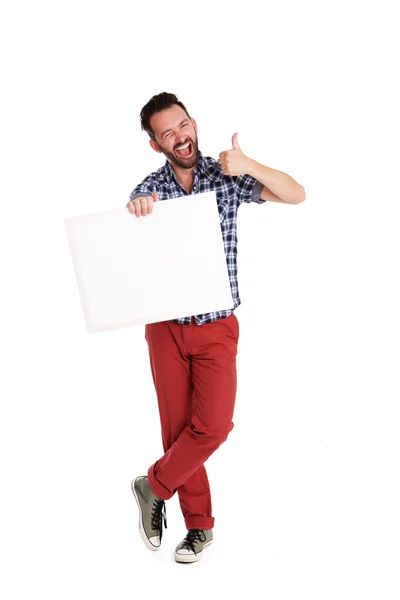 Vesel om care deține poster gol și arătând degetele în sus — Fotografie, imagine de stoc