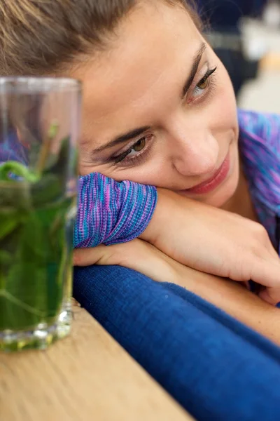 Cozy woman sitting in cafe — Stock Photo, Image