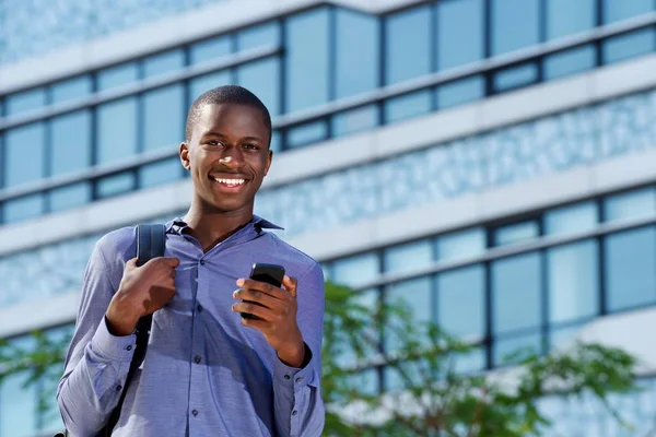 Man outdoors with mobile phone — Stock Photo, Image