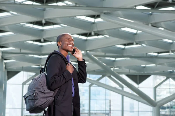 Businessman with phone and bag — Stock Photo, Image