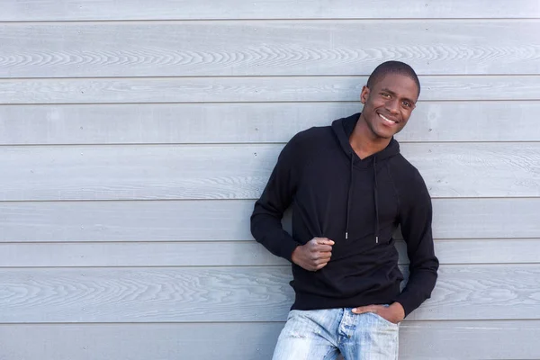 Guy smiling in black sweatshirt — Stock Photo, Image