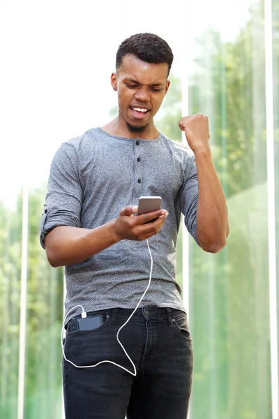 Man standing and using phone — Stock Photo, Image