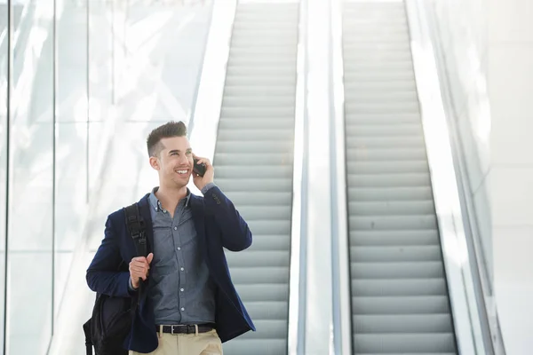 Man on telephone call by escalator — Stock Photo, Image