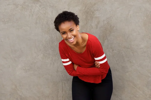 Woman laughing with arms crossed — Stock Photo, Image