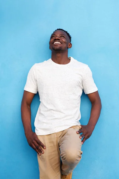 African american man against blue wall — Stock Photo, Image