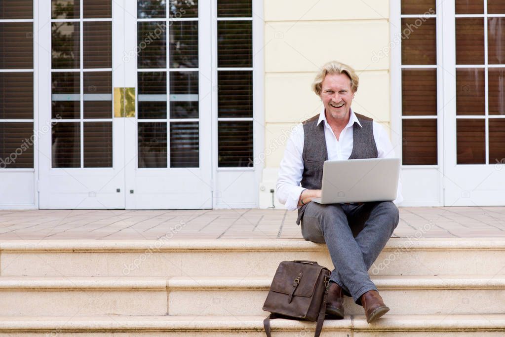 businessman sitting with laptop