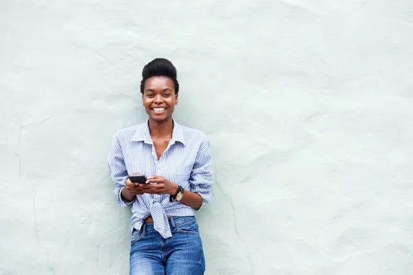 black woman holding cellpone