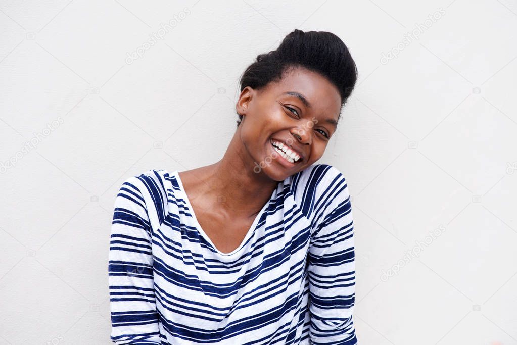 woman laughing against white background 