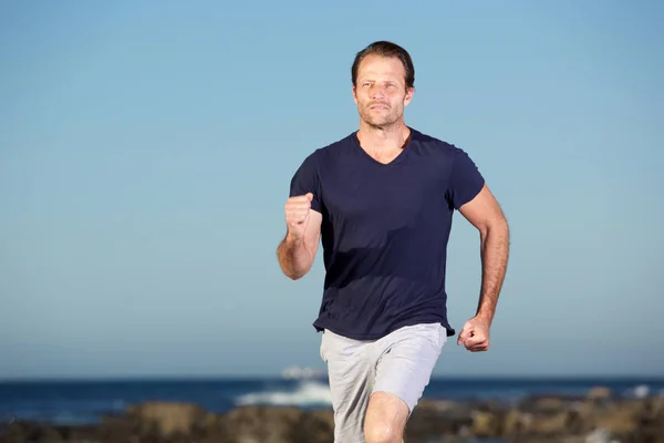 Man running outdoors — Stock Photo, Image