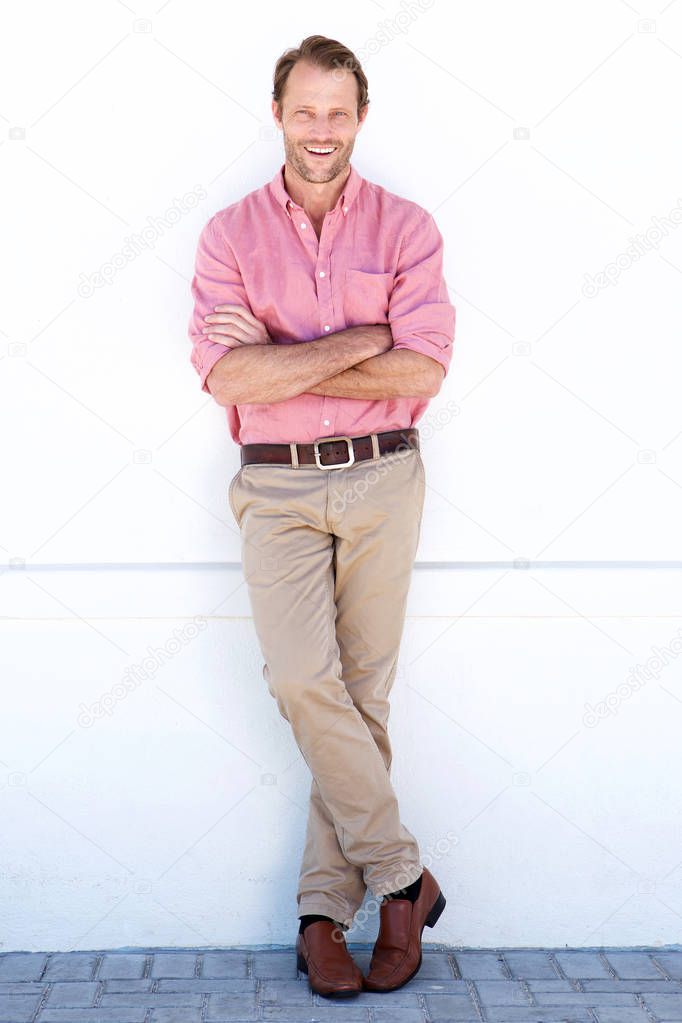 handsome man against white wall