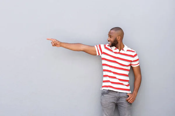 Young african man pointing — Stock Photo, Image