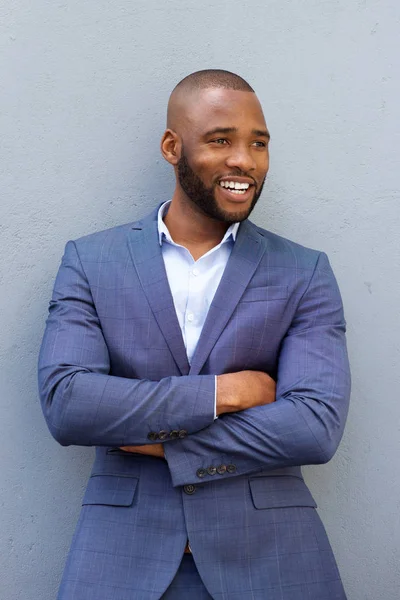 Businessman leaning against wall — Stock Photo, Image