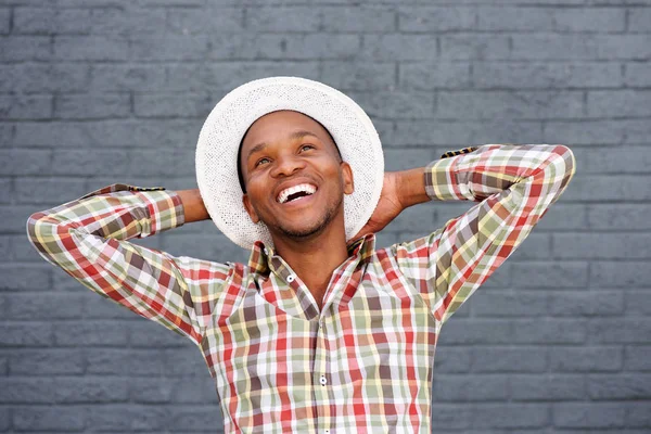 man with hat laughing
