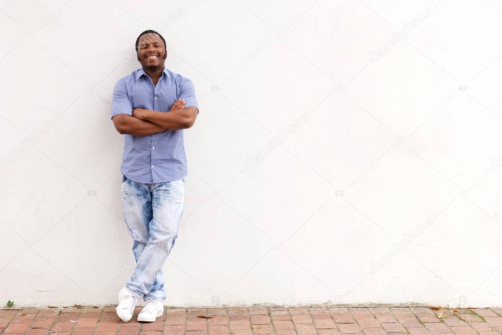 man leaning against wall