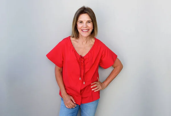 Woman against gray background — Stock Photo, Image