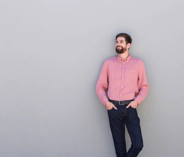 Man against gray wall — Stock Photo, Image