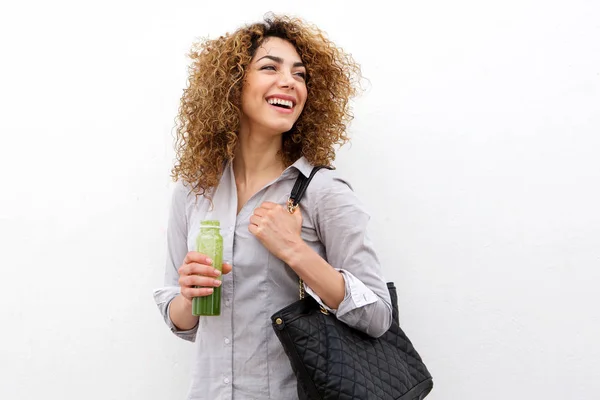 Mujer riendo con la botella de jugo —  Fotos de Stock