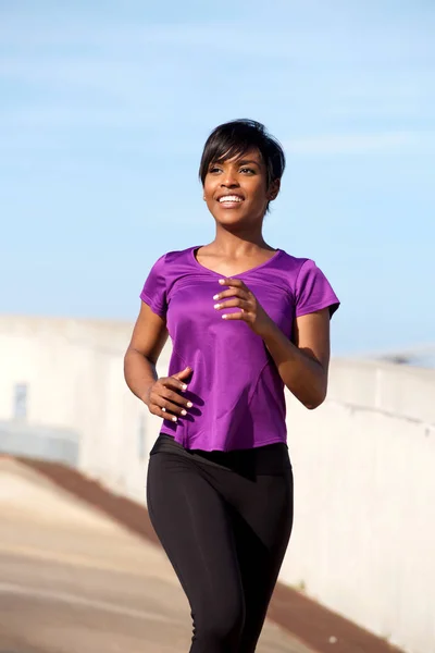 Young black lady jogging — Zdjęcie stockowe