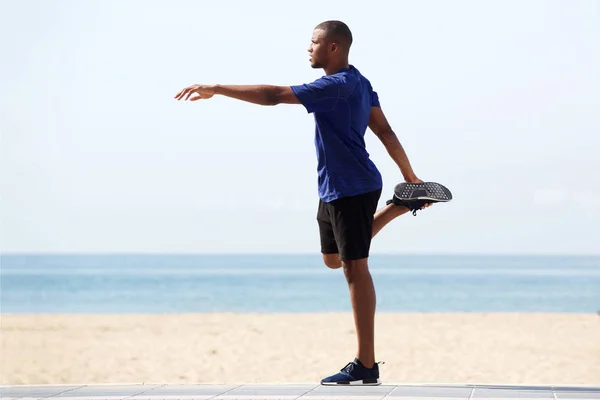 african man doing warm up exercise