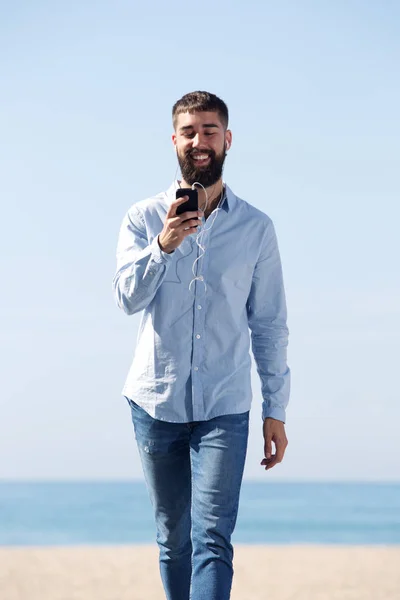 Smiling man with mobile phone