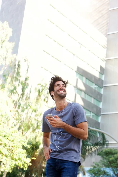 Laughing man standing on street — Stock Photo, Image