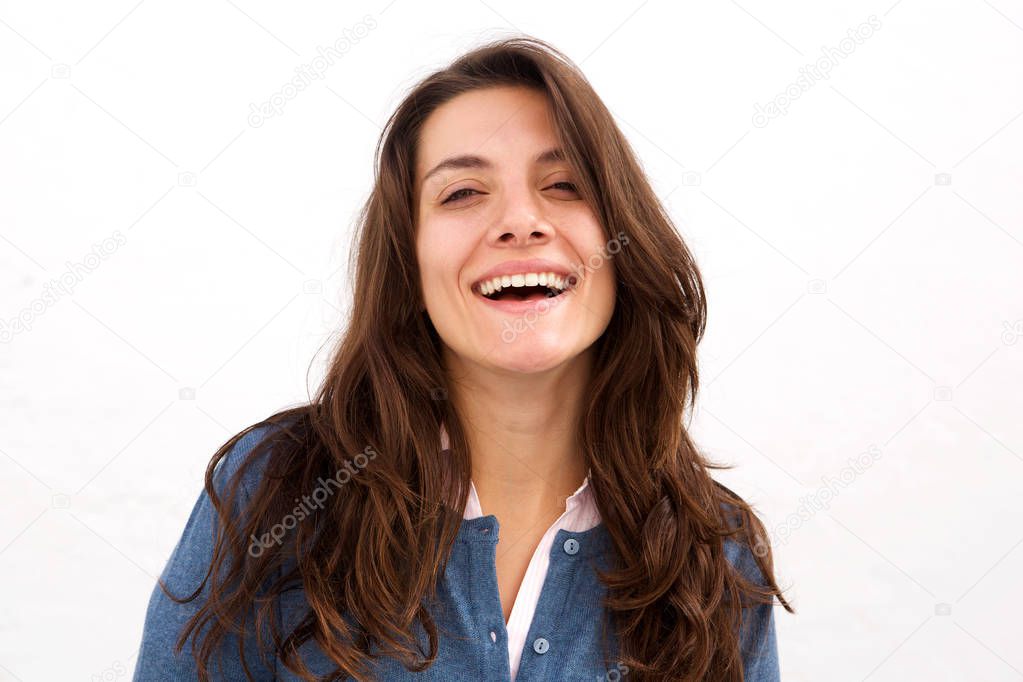 Close up portrait of beautiful woman laughing standing by white background