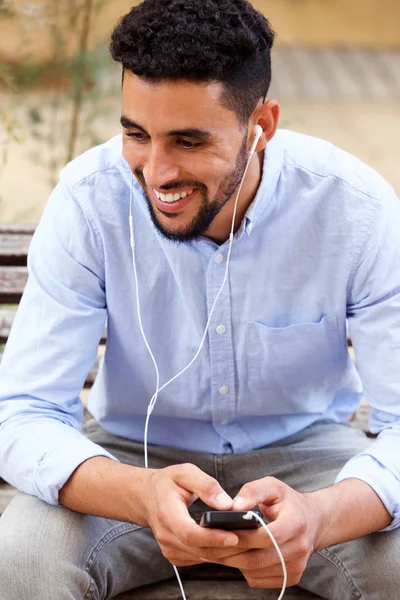 Close Portrait Smiling Arabic Man Listening Music Mobile Phone — Stock Photo, Image