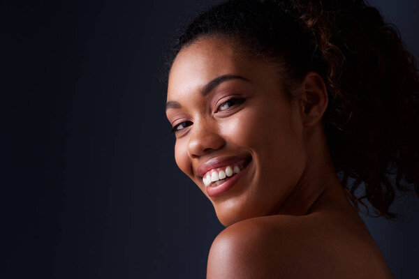 Close up beauty portrait of african fashion model smiling