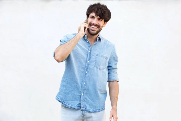 Portrait Happy Young Man Talking Cellphone White Wall — Stock Photo, Image