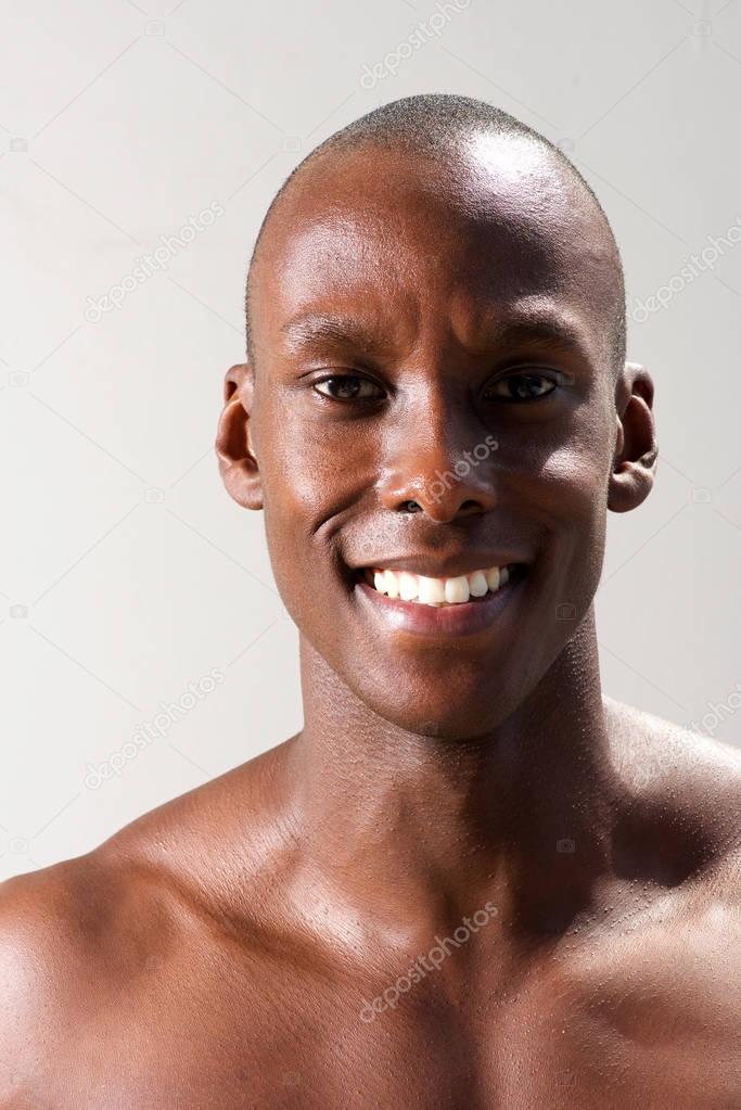 Close up portrait of smiling handsome black man 