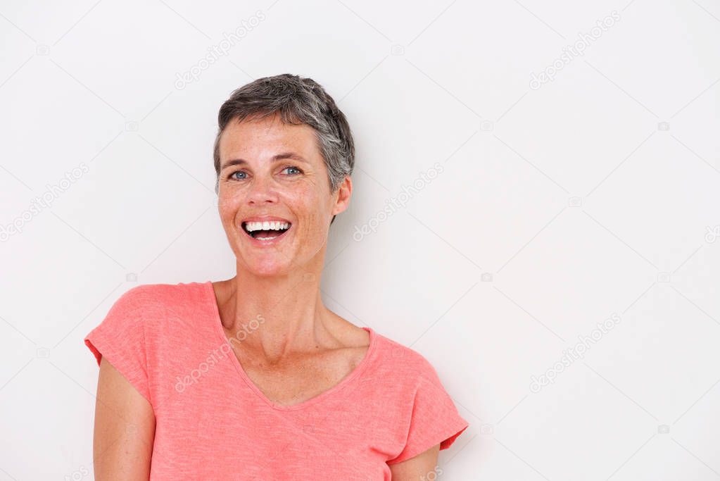 Close up horizontal portrait of happy older woman on white background