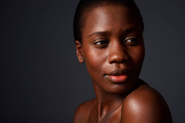 Close up portrait of beautiful face of young african woman with clean skin
