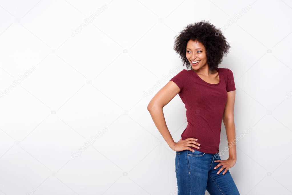 Portrait of stylish female fashion model posing against white background and looking away