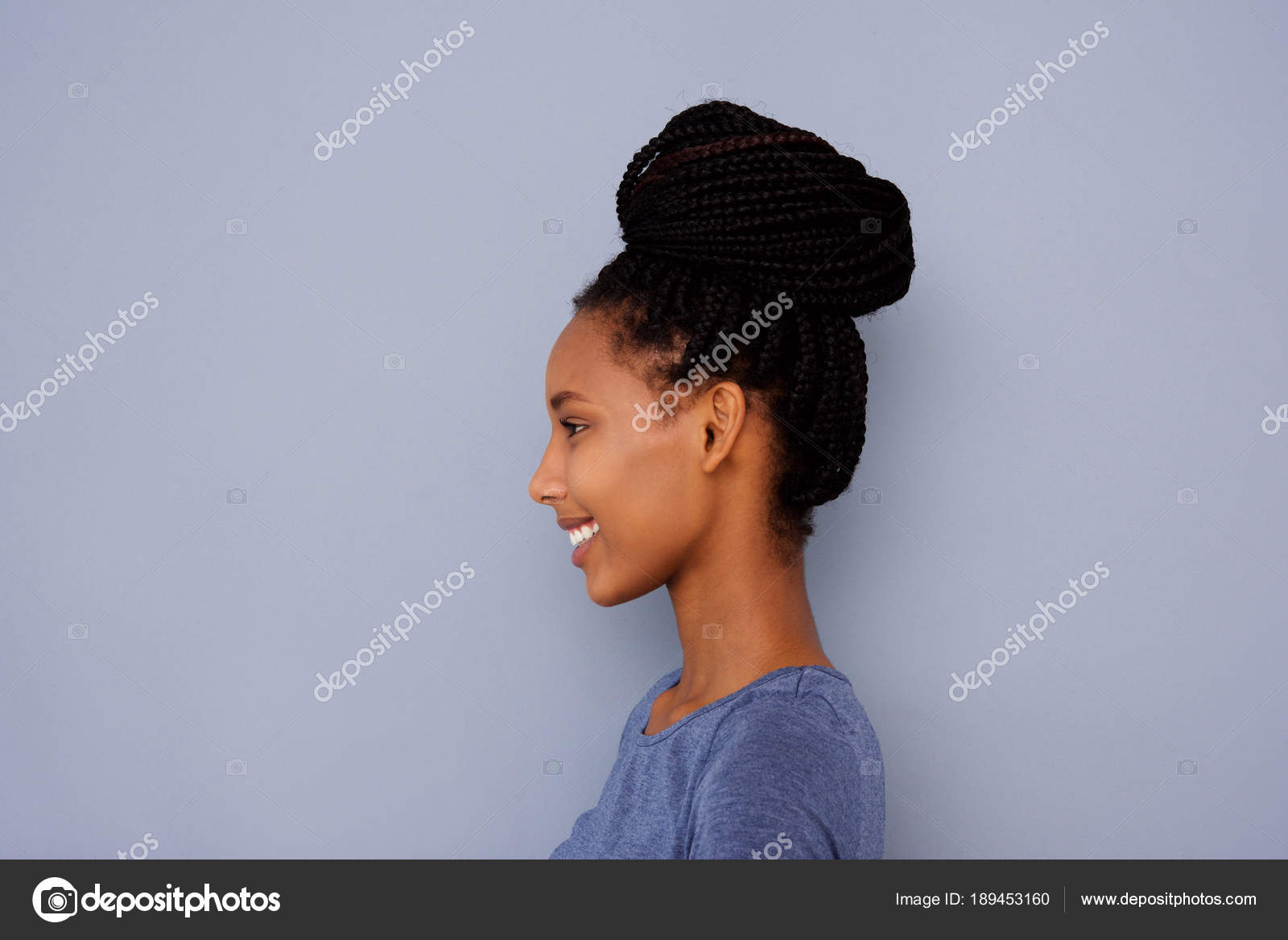 Close Side Portrait Young Girl Braided Hair Bun Gray Wall Stock