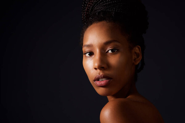 Close up beauty portrait of african american fashion woman against dark background