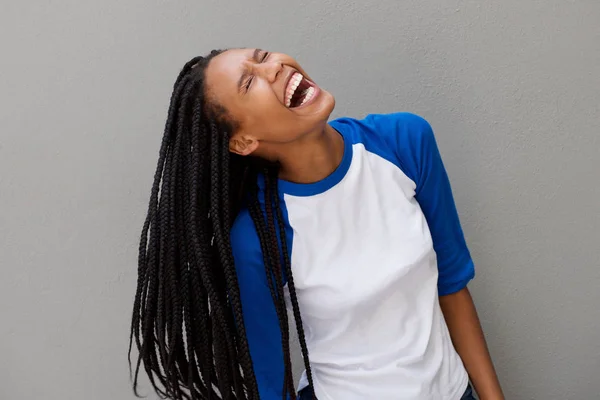 Portrait Cheerful Young Black Woman Long Braided Hair Laughing Gray — Stock Photo, Image