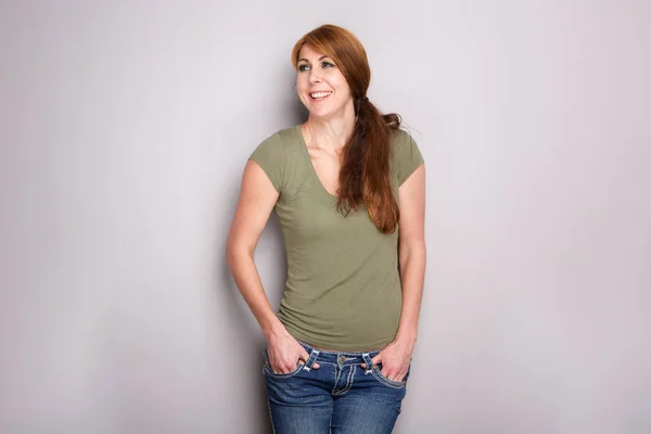 Portrait Pretty Mature Woman Standing Gray Wall Her Hands Pocket — Stock Photo, Image